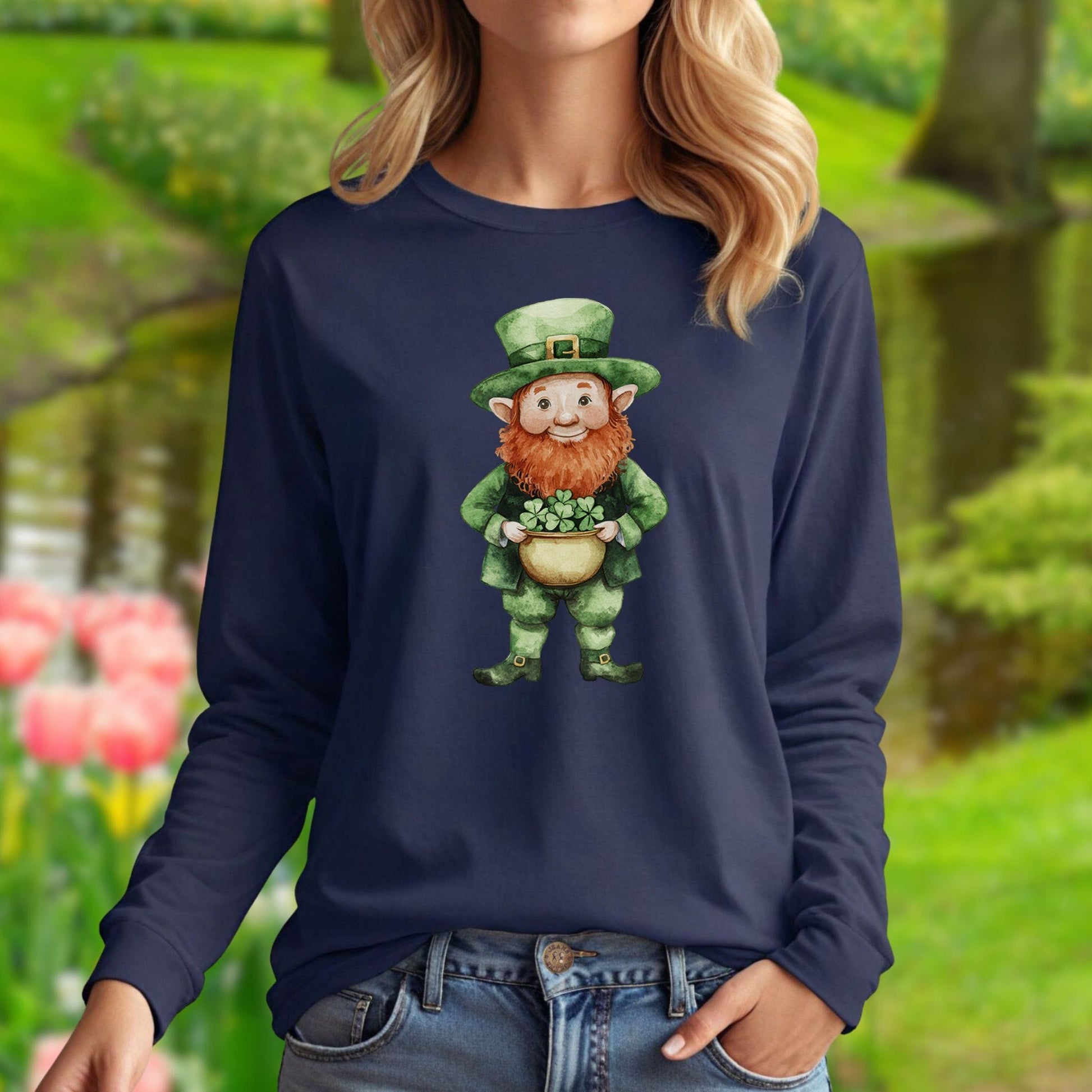 Navy long-sleeve tee with a watercolor leprechaun holding a shamrock plant.