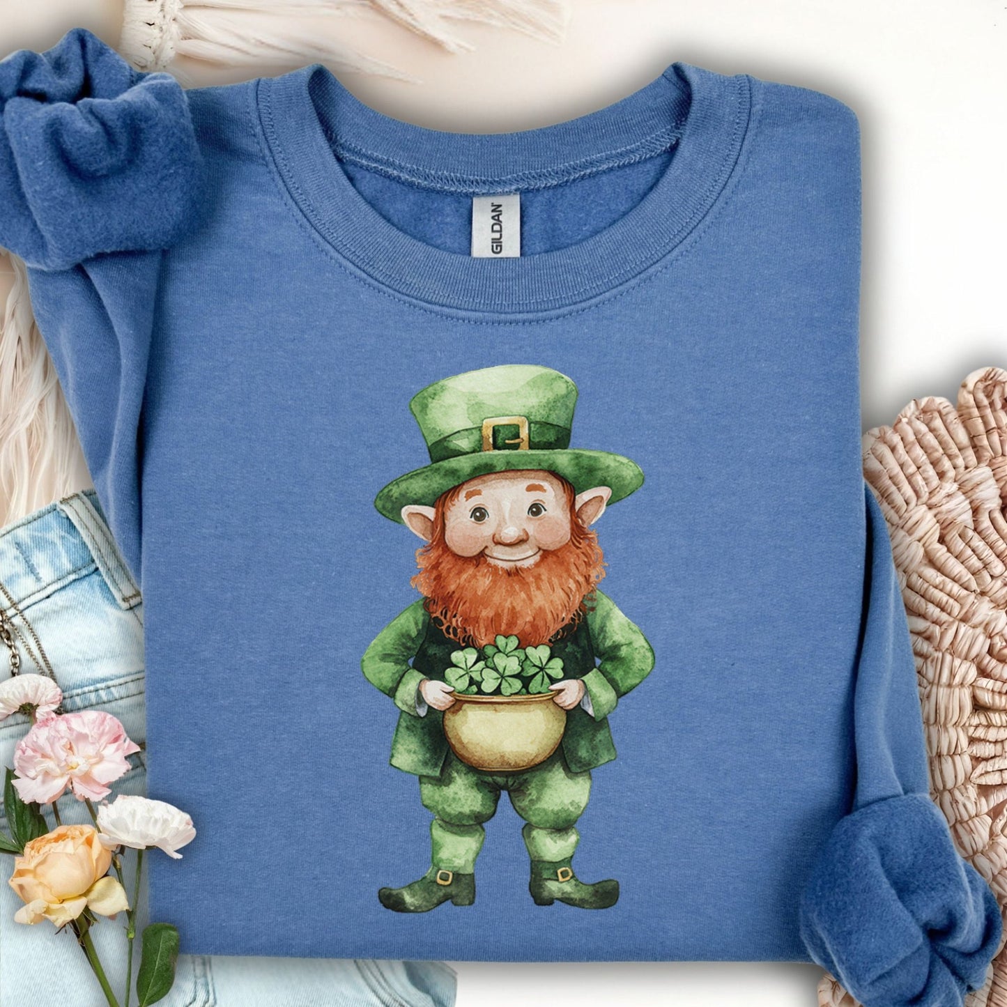 Indigo blue unisex cotton-poly sweatshirt with a watercolor leprechaun holding a four-leaf clover.