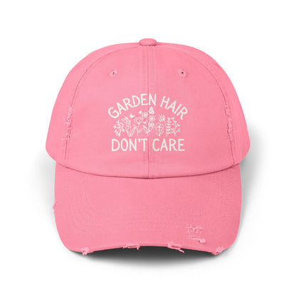 True Pink distressed cotton twill "Garden Hair Don't Care" cap with white text and floral design.