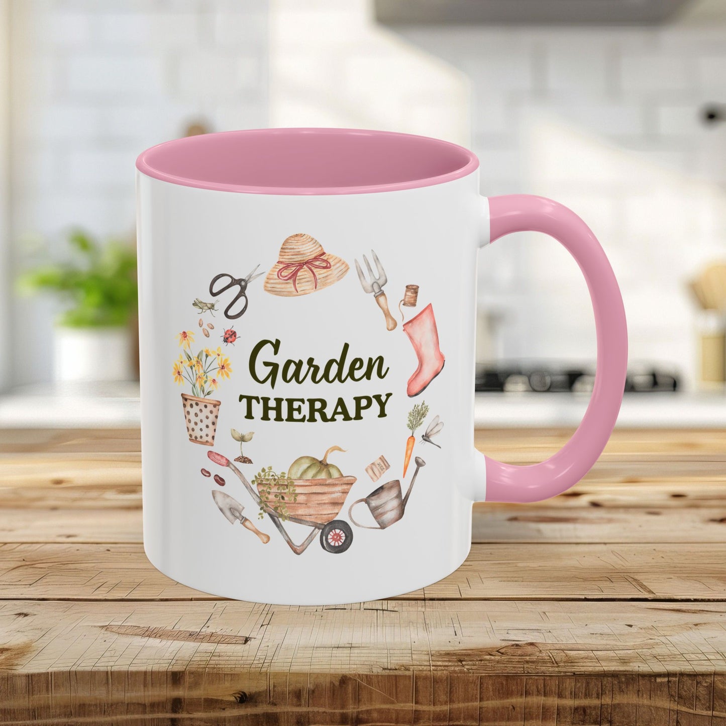 11oz ceramic mug with pink handle/interior, "Garden Therapy" text, and watercolor garden tool wreath design.