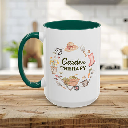 White ceramic mug with green handle and interior, featuring a "Garden Therapy" wreath design.