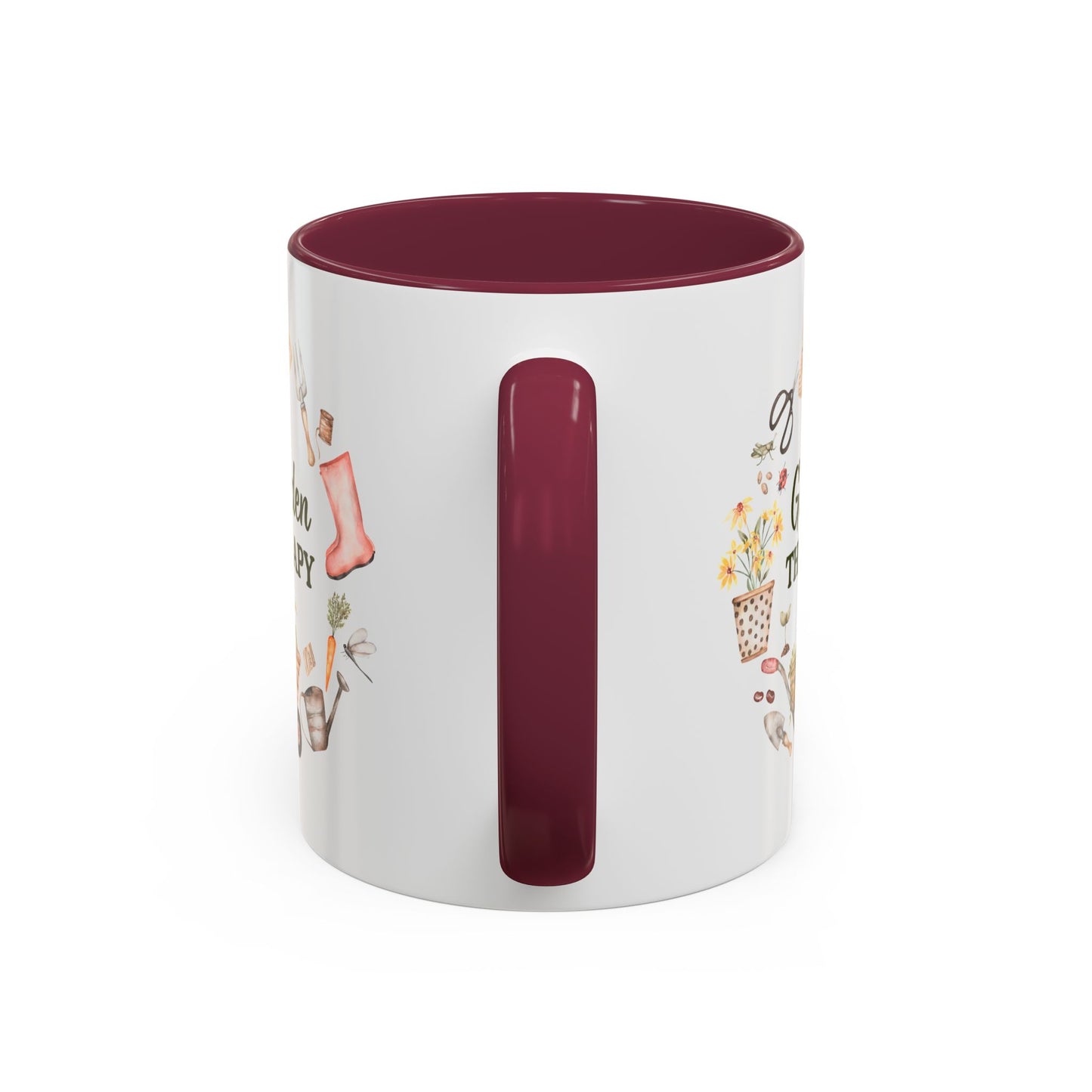 White ceramic 11oz mug with a maroon handle and interior, featuring a "Garden Therapy" floral wreath design.
