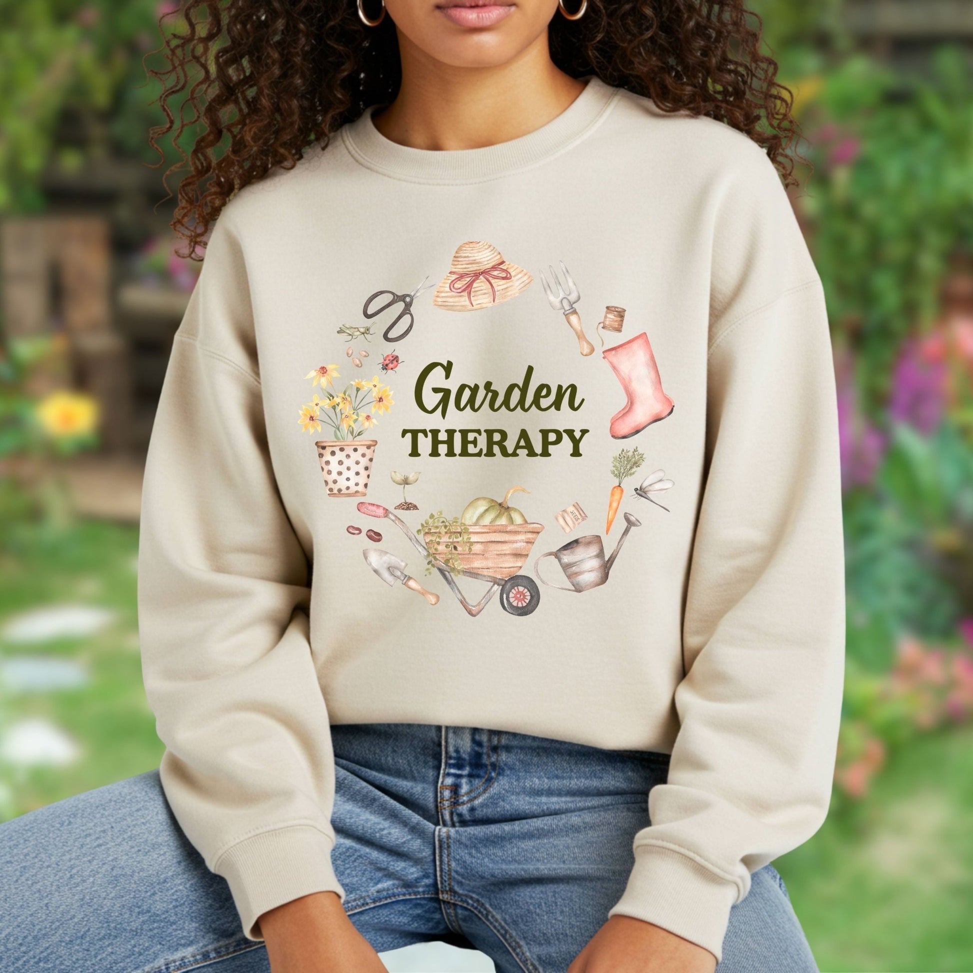 Beige crewneck sweatshirt with "Garden Therapy" and a watercolor floral wreath of gardening tools.