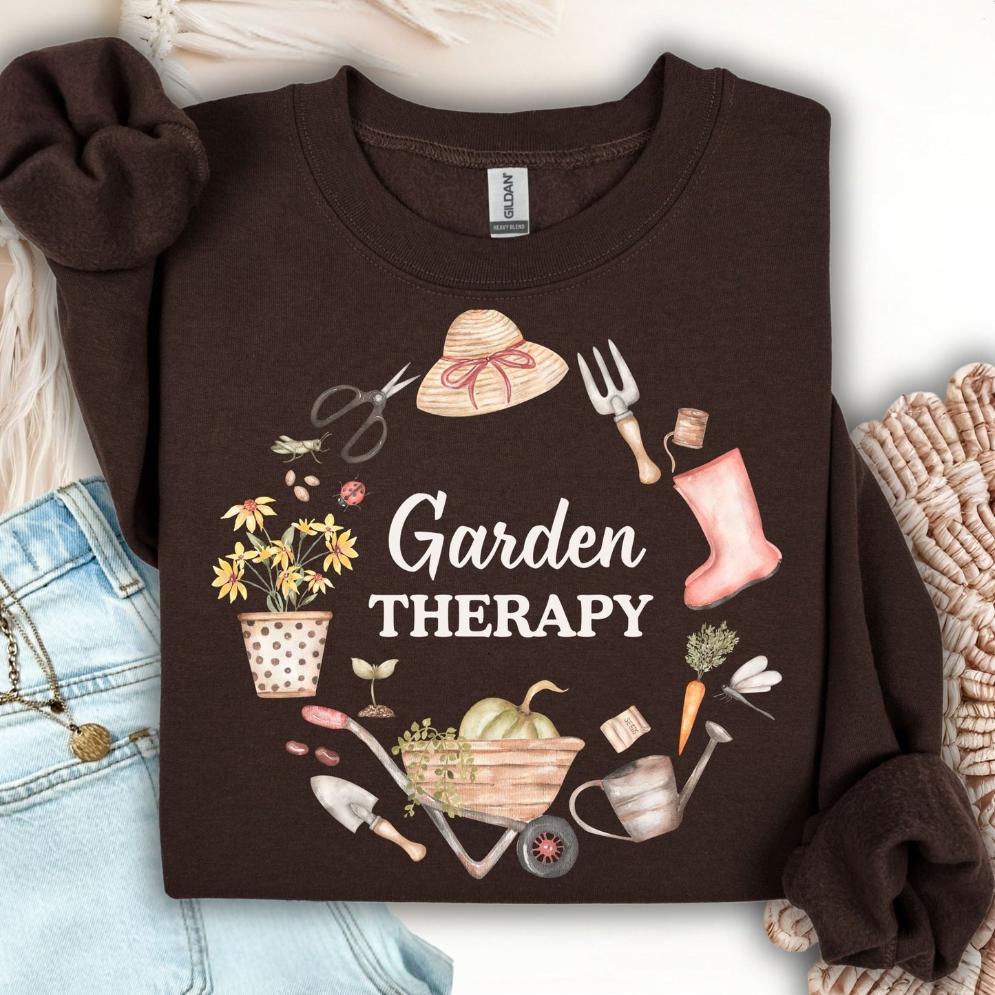 Dark Chocolate crewneck sweatshirt with "Garden Therapy" text surrounded by a floral wreath of gardening tools.