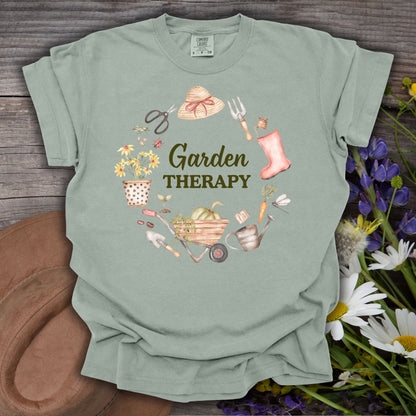 Bay green, relaxed-fit cotton t-shirt with "Garden Therapy" in a floral wreath of garden tools.