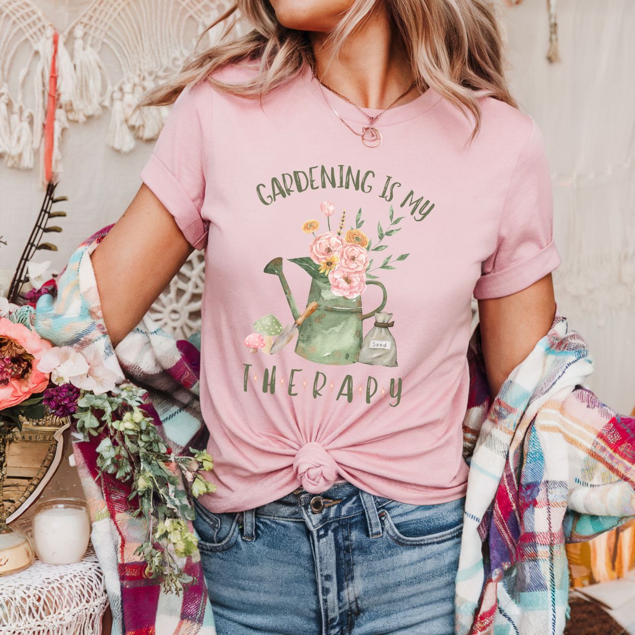 Pink cotton t-shirt with "Gardening Is My Therapy" text and a watercolor watering can, flowers, and trowel design.