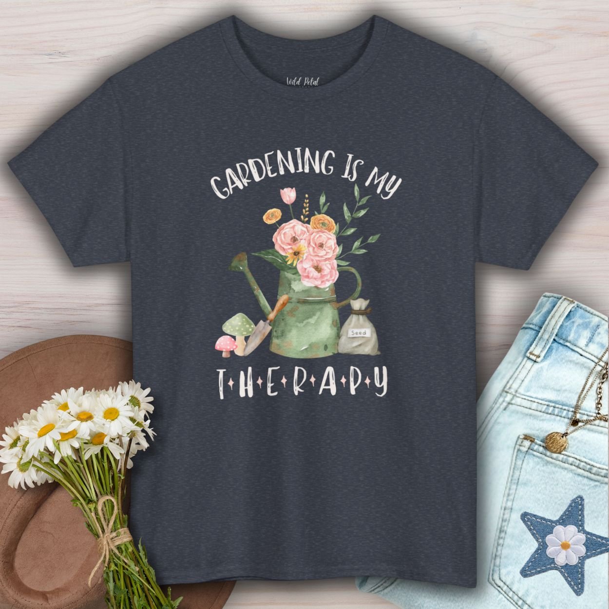 Heather Navy S-size tee with "Gardening Is My Therapy" watercolor watering can, flowers, and seed bag design.
