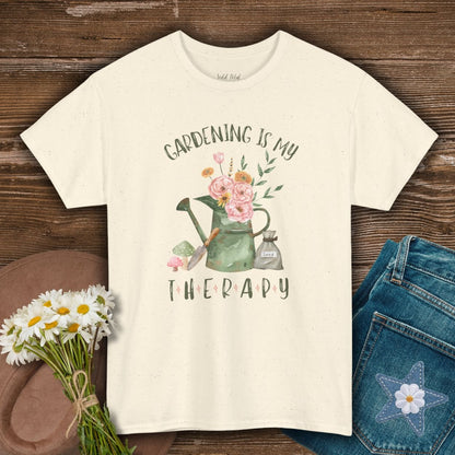 Natural S-size t-shirt with "Gardening Is My Therapy" text and a watercolor watering can, flowers, and seeds design.
