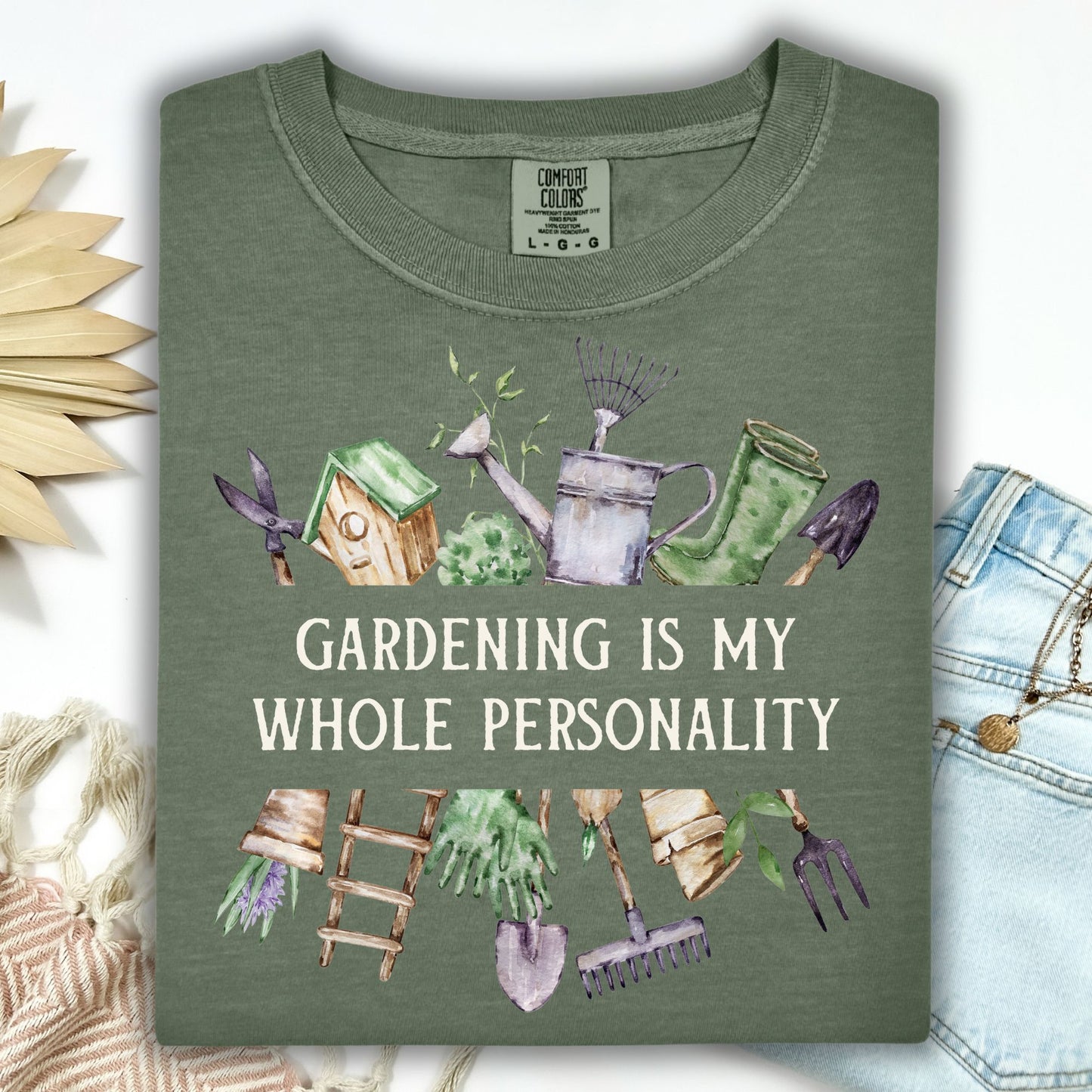 Moss green Comfort Colors t-shirt with "Gardening Is My Whole Personality" and watercolor garden tools.
