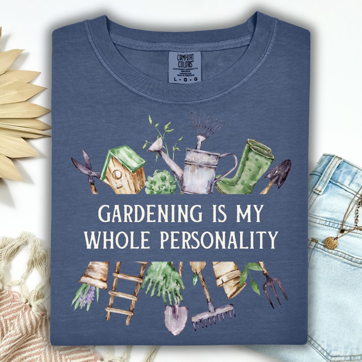 Denim t-shirt with "Gardening Is My Whole Personality" and watercolor gardening tools and florals.