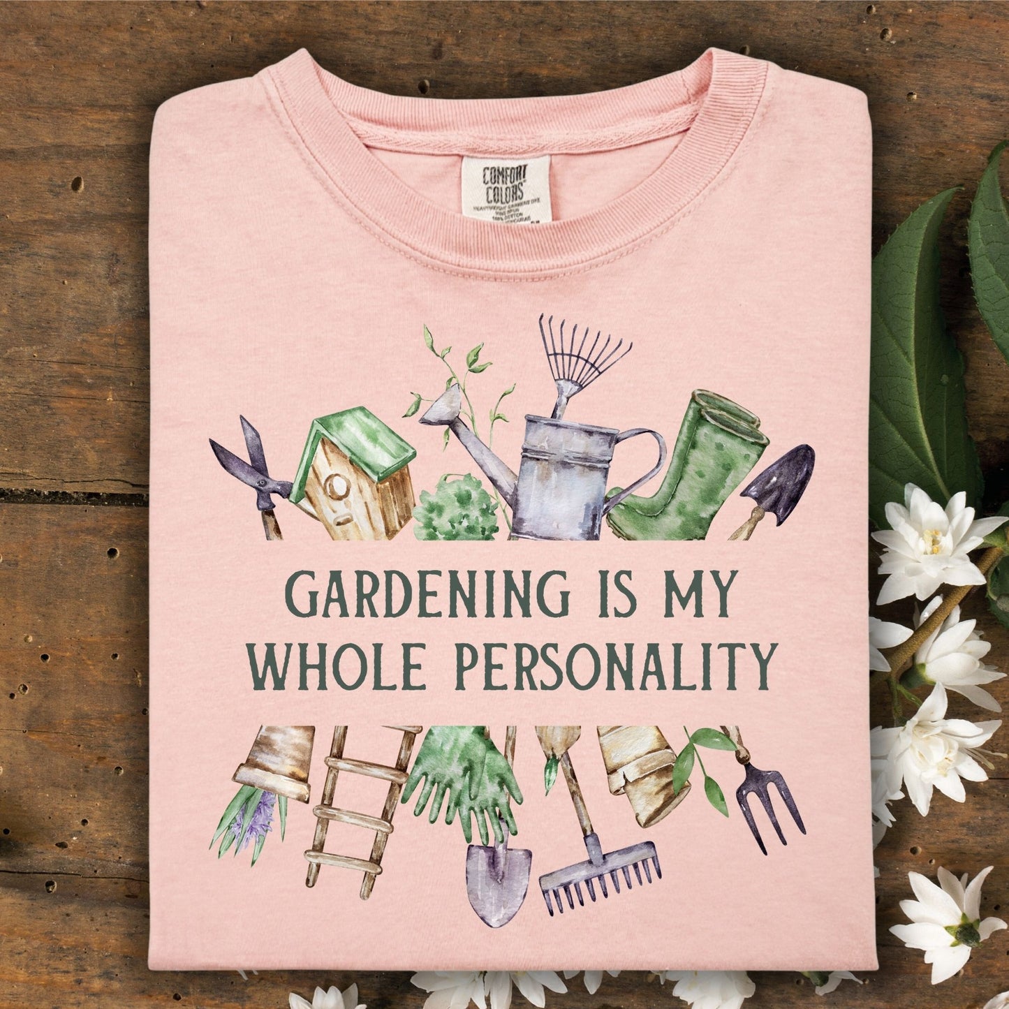 Peachy Comfort Colors t-shirt with "Gardening Is My Whole Personality" and watercolor tools/florals.
