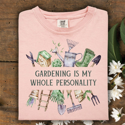 Peachy Comfort Colors t-shirt with "Gardening Is My Whole Personality" and watercolor tools/florals.