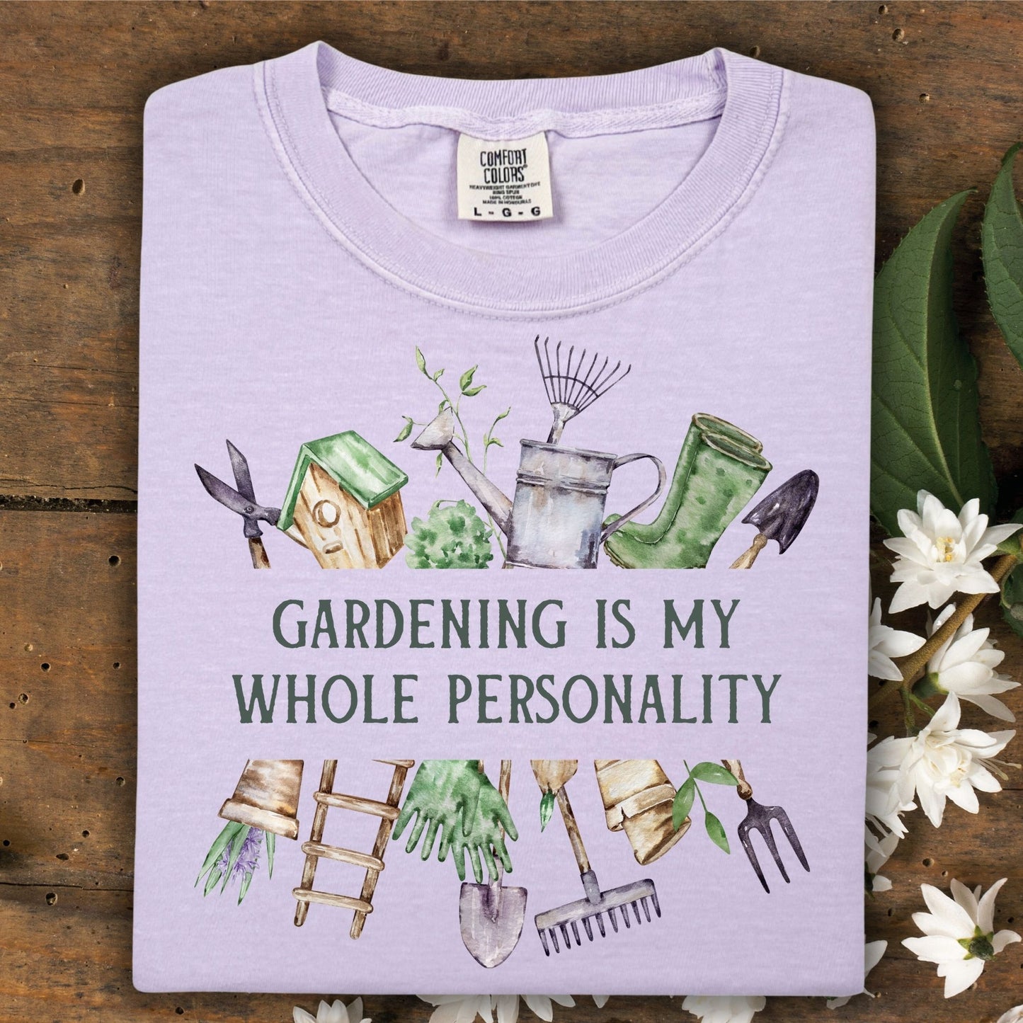 Orchid Comfort Colors t-shirt with "Gardening Is My Whole Personality" and watercolor gardening tools.