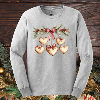 Ash gray long sleeve tee with a watercolor gingerbread heart garland design.