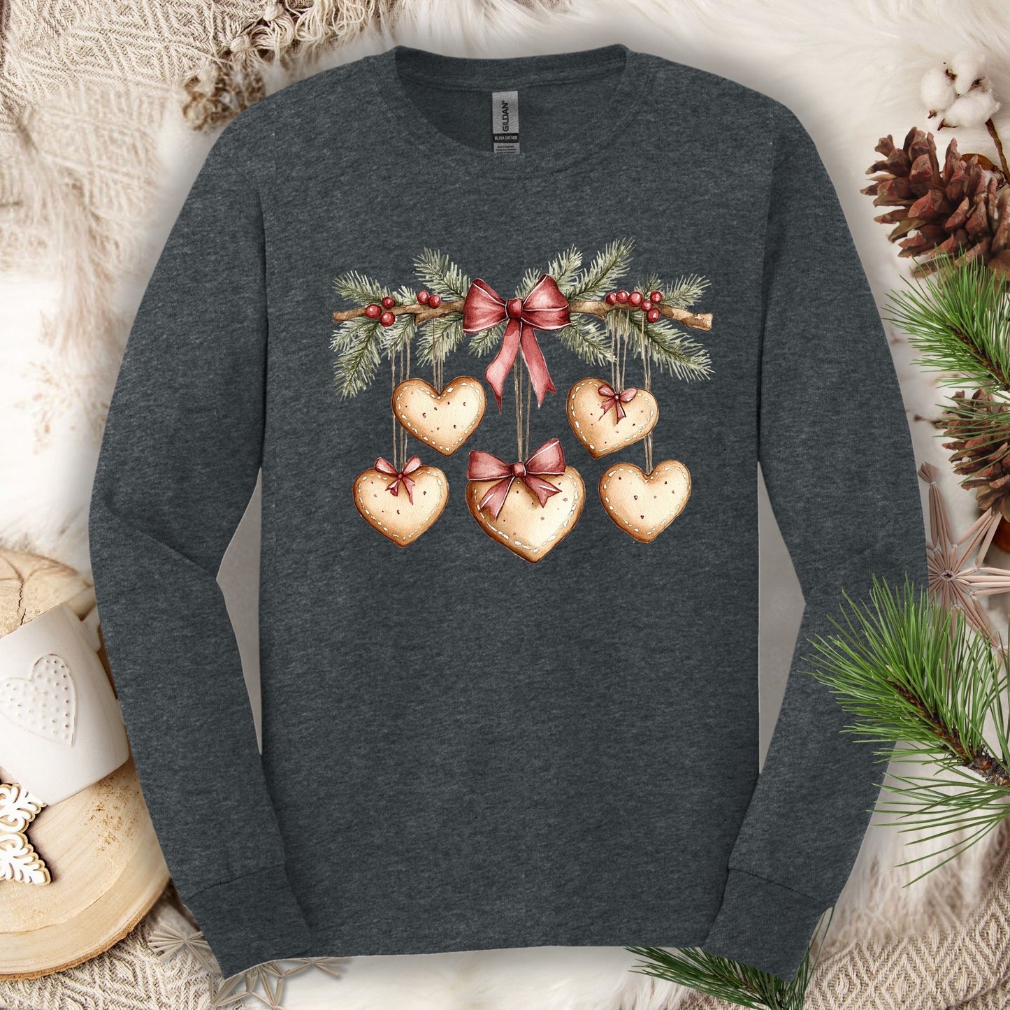 Dark Heather long sleeve tee with a watercolor gingerbread heart garland design.
