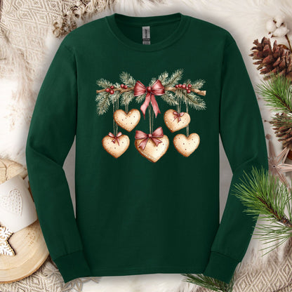 Forest Green long sleeve tee with a watercolor gingerbread heart garland design.