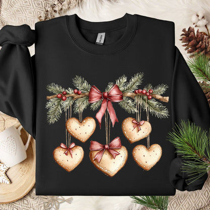 Black cotton-poly fleece sweatshirt with watercolor evergreen garland and gingerbread heart cookies.