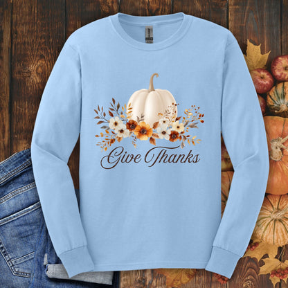 Light blue Gildan long sleeve tee, size S, with a watercolor white pumpkin, autumn foliage, and "Give Thanks" text.