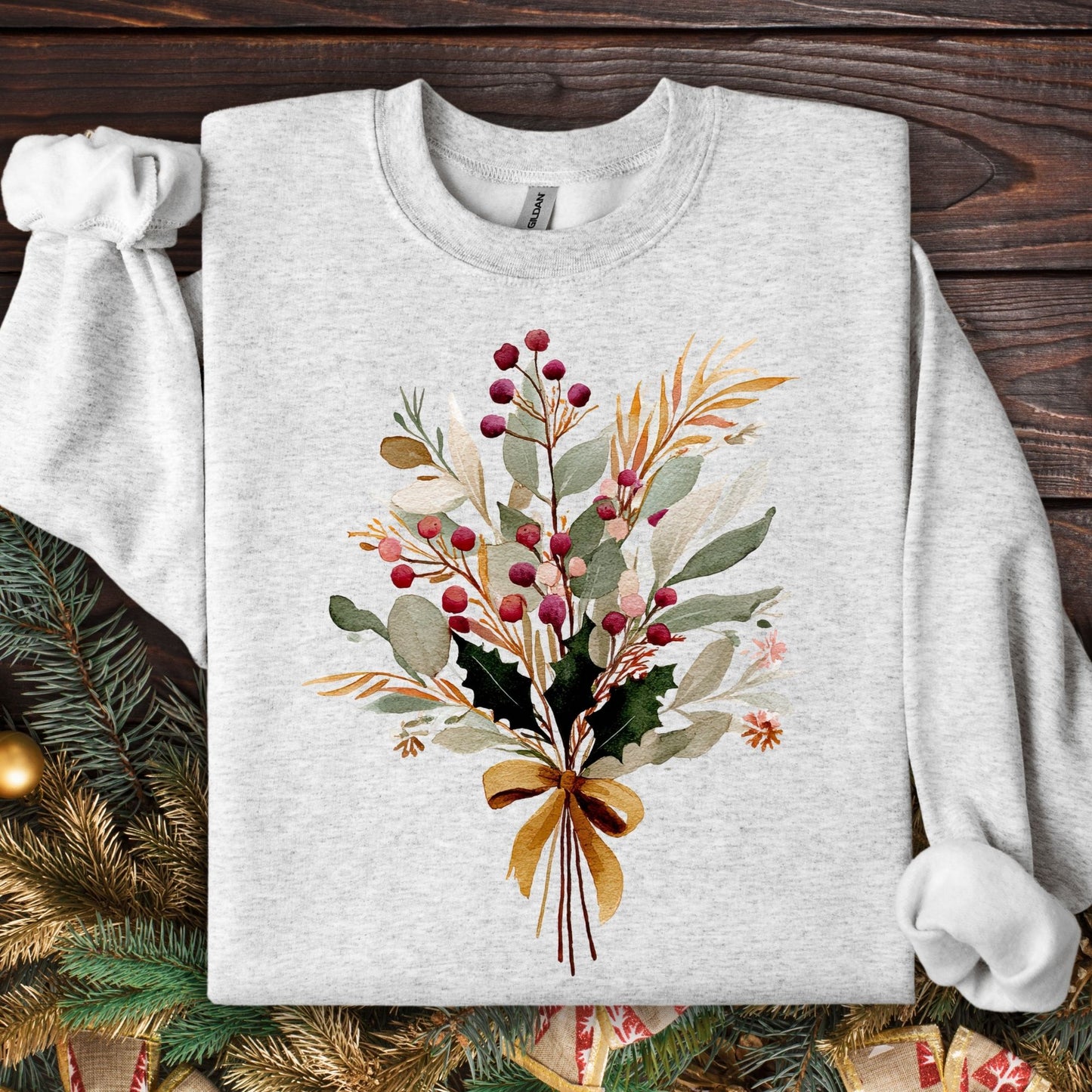 Ash S sweatshirt with a watercolor Christmas bouquet tied with a golden bow.