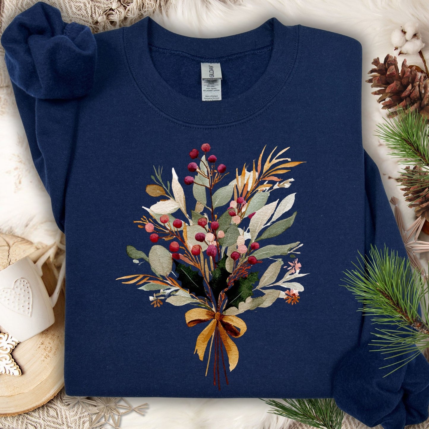 Navy Gold Holiday Bouquet Sweatshirt with watercolor berries, eucalyptus, and evergreen sprigs tied with a golden bow.