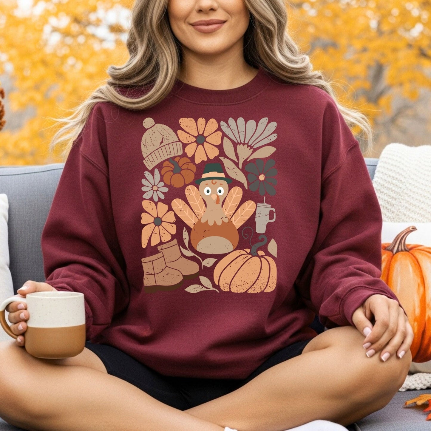 Maroon Gildan 18000 sweatshirt with a groovy turkey, fall leaves, boots, hat, and florals.