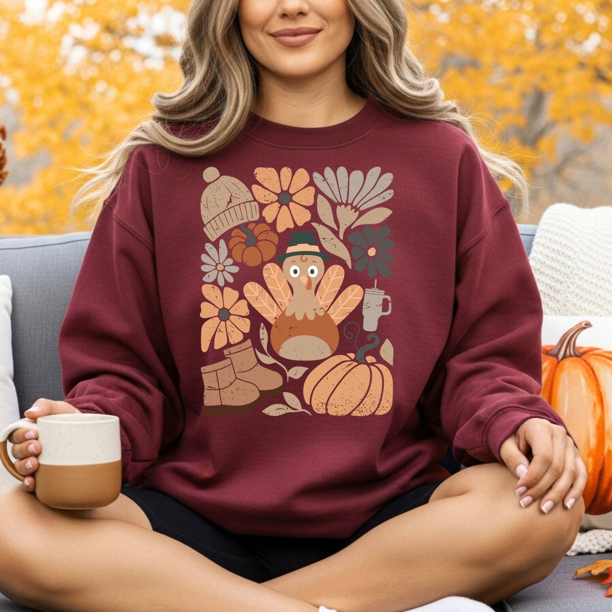 Maroon Gildan 18000 sweatshirt with a groovy turkey, fall leaves, boots, hat, and florals.