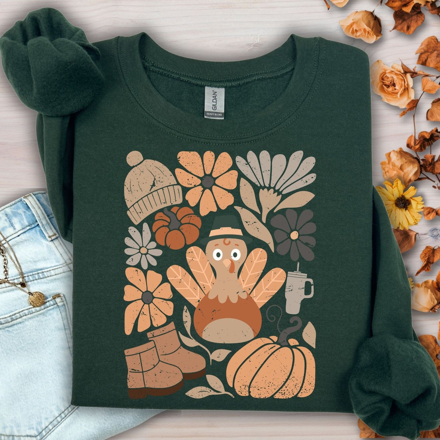 Forest Green Gildan 18000 sweatshirt with a groovy turkey, fall leaves, boots, and florals design.