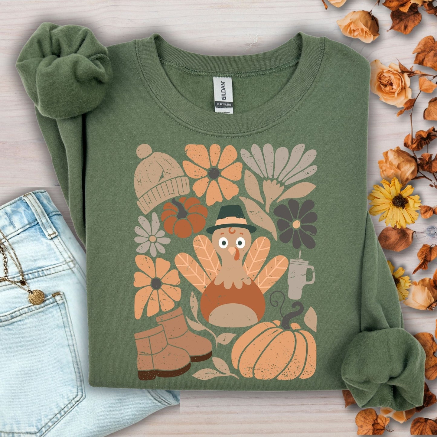Military Green Gildan 18000 sweatshirt with a groovy turkey, fall leaves, boots, and florals design.