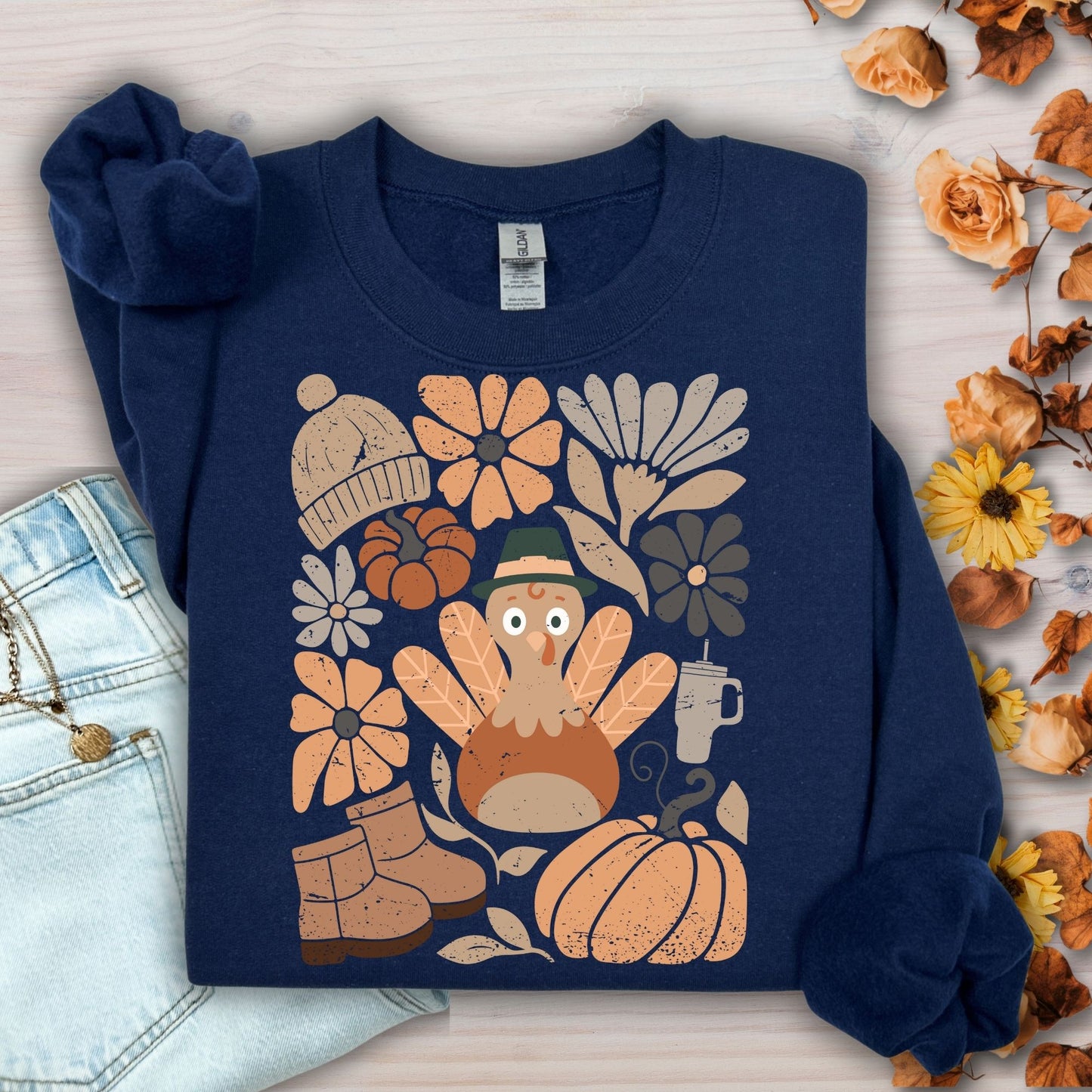 Navy Gildan 18000 sweatshirt with a groovy turkey, fall leaves, boots, hat, and rustic florals.