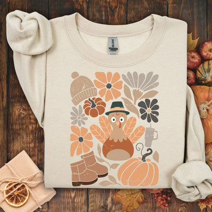 Sand Gildan 18000 sweatshirt with a groovy turkey, fall leaves, boots, hat, and rustic florals.