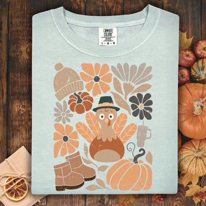 Bay Comfort Colors t-shirt with a groovy turkey, pumpkins, boots, and autumn flowers design.