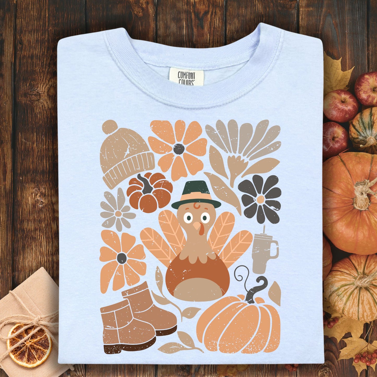 Hydrangea Comfort Colors t-shirt with a groovy turkey, pumpkins, flowers, boots, and hat.