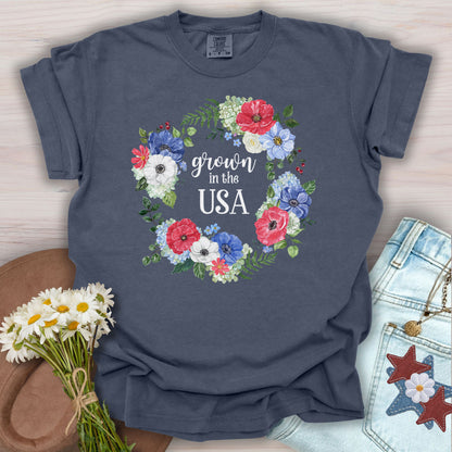Denim S "Grown in the USA" t-shirt with a watercolor floral wreath of poppies, daisies, and wildflowers.