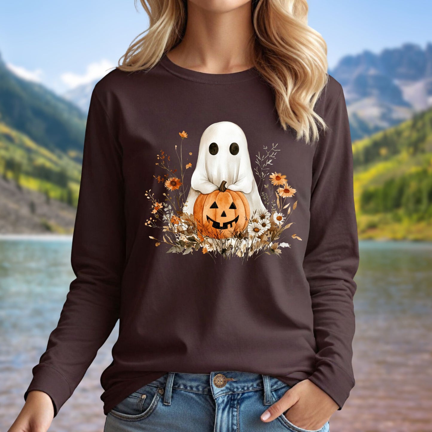 Brown long sleeve tee with a boho ghost holding a pumpkin, surrounded by earthy florals.
