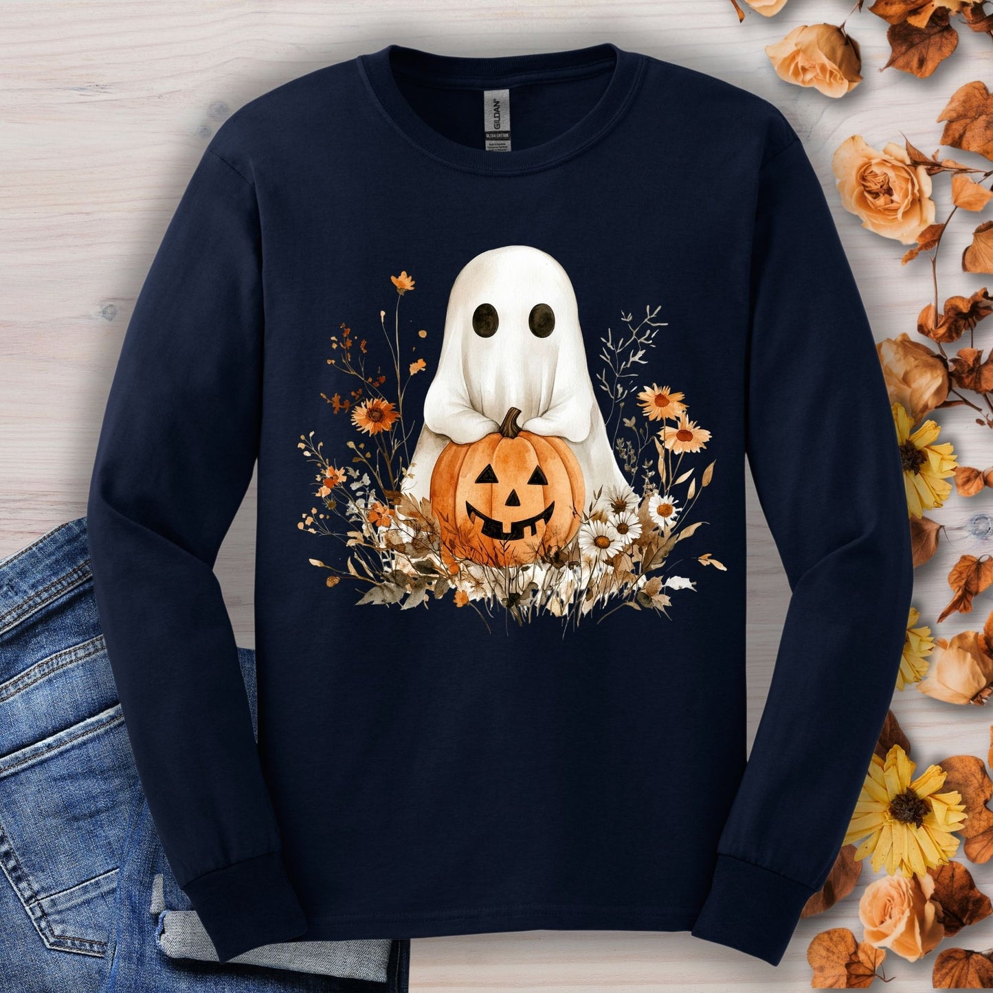 Navy long sleeve tee with a boho ghost holding a pumpkin surrounded by earthy florals.