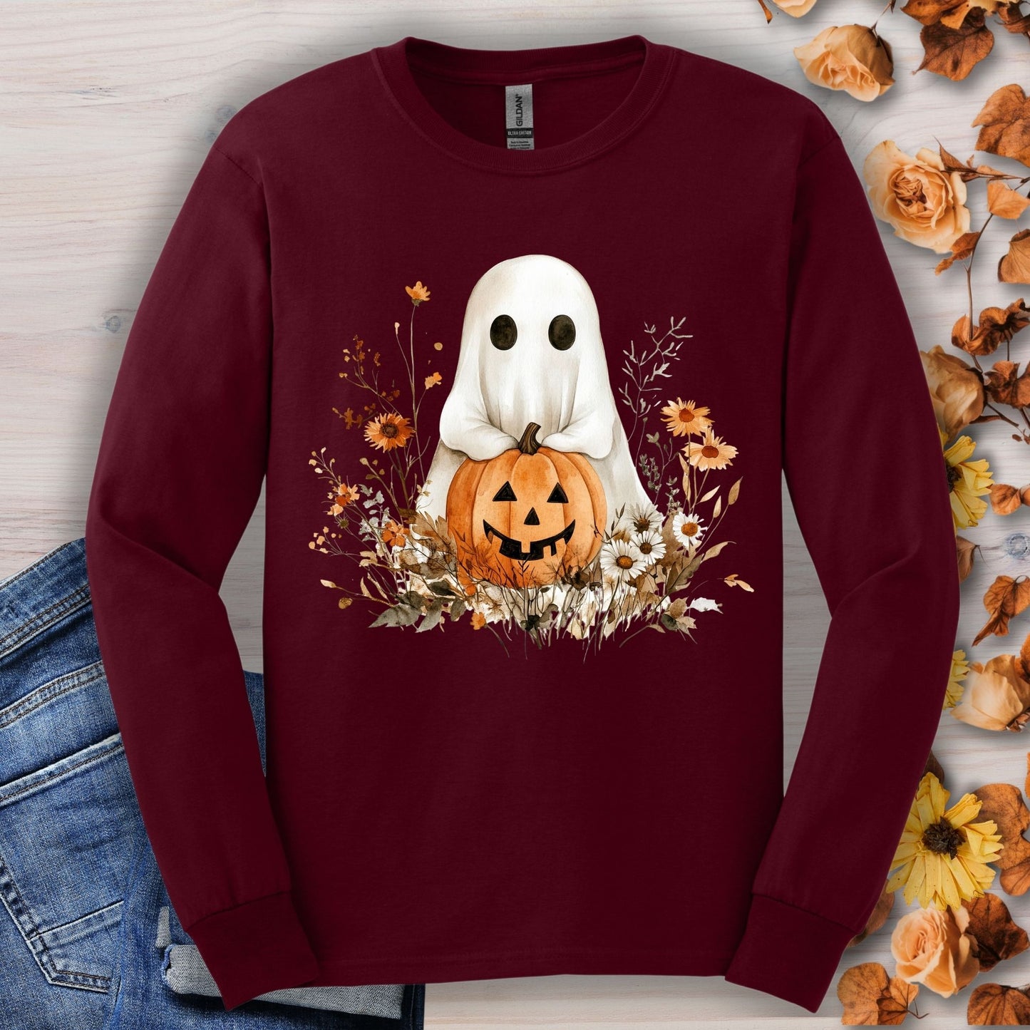 Maroon long sleeve tee with a boho ghost holding a pumpkin surrounded by fall florals.