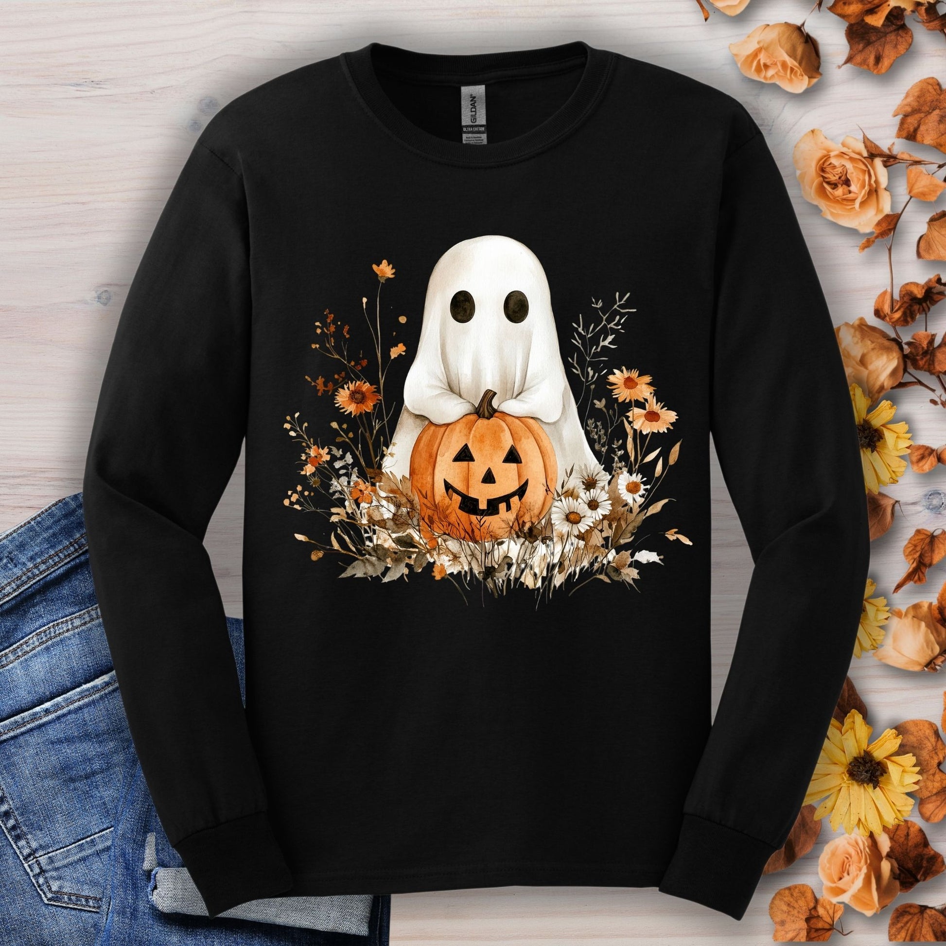 Black long sleeve tee with a boho ghost holding a pumpkin, surrounded by earthy florals.