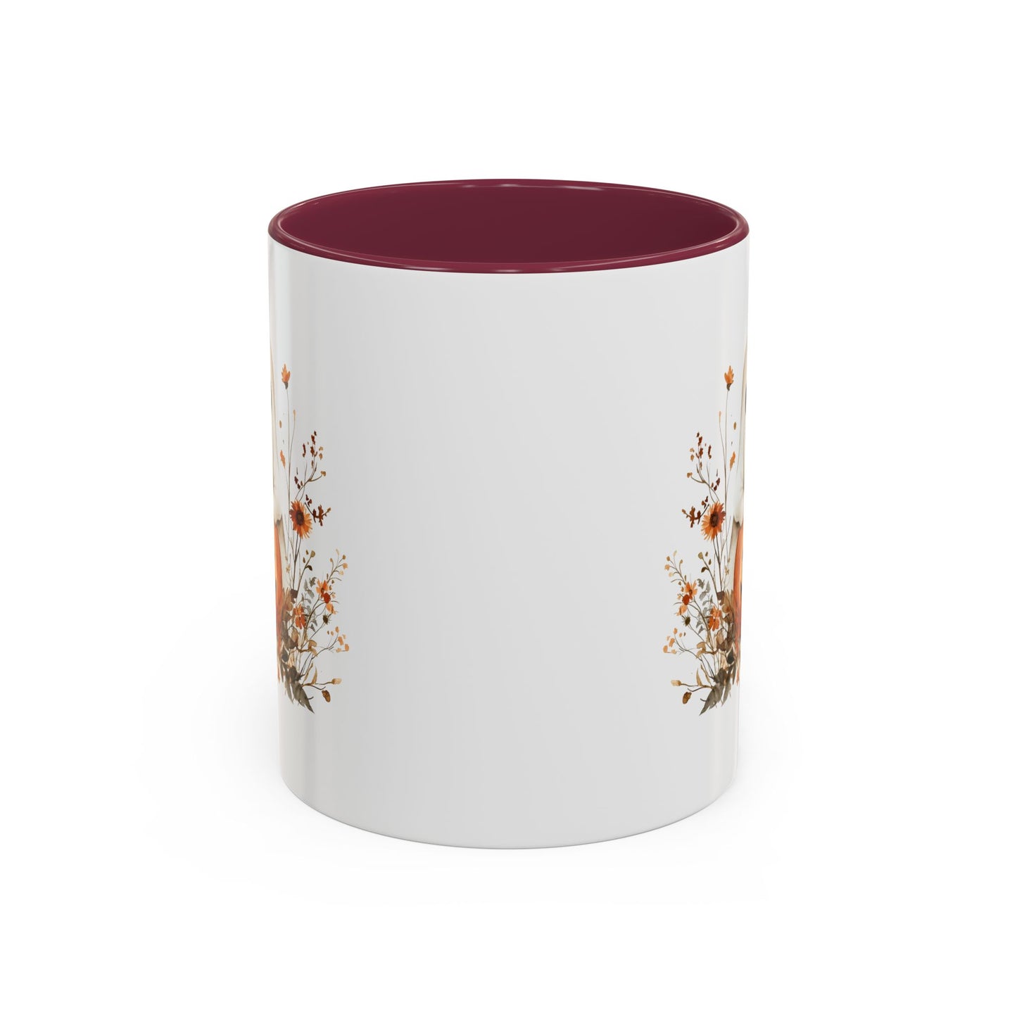 White ceramic mug with a dark red interior and handle, featuring a boho ghost on a jack-o'-lantern with wildflowers.