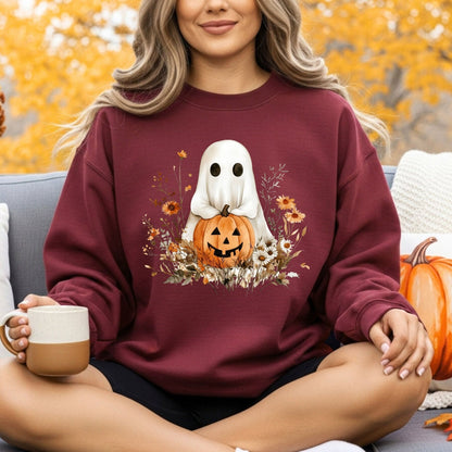 Maroon unisex sweatshirt with a cute boho ghost holding a jack o'lantern, surrounded by autumn wildflowers.