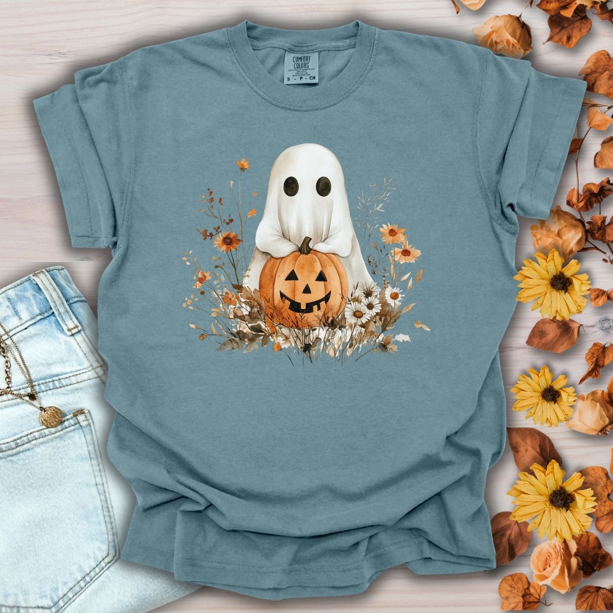Ice Blue Halloween Boho Ghost T-Shirt with Jack O'Lantern, pumpkins, and autumn florals, made from 100% cotton.