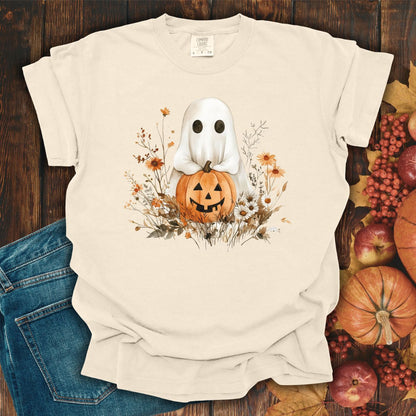 Ivory cotton t-shirt with a boho ghost holding a jack o'lantern, surrounded by autumn florals.