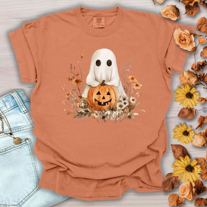 Yam orange Boho Ghost t-shirt with a white ghost holding a Jack O'Lantern, surrounded by autumn florals.