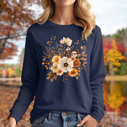 Navy long-sleeve tee with a cottagecore autumn floral design, worn by a woman outdoors.