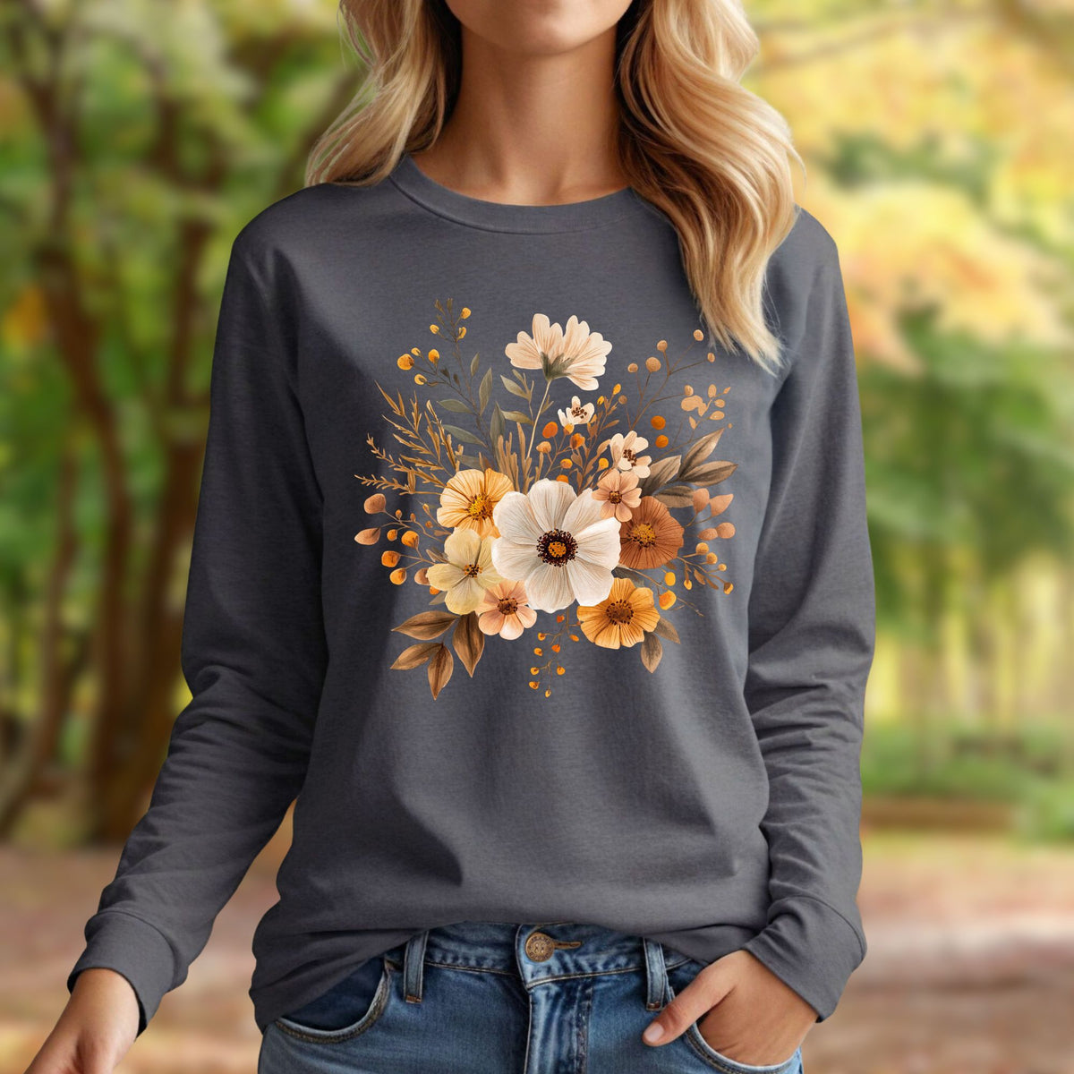 Charcoal long sleeve tee with a muted autumn floral design, worn by a woman in a fall outdoor setting.