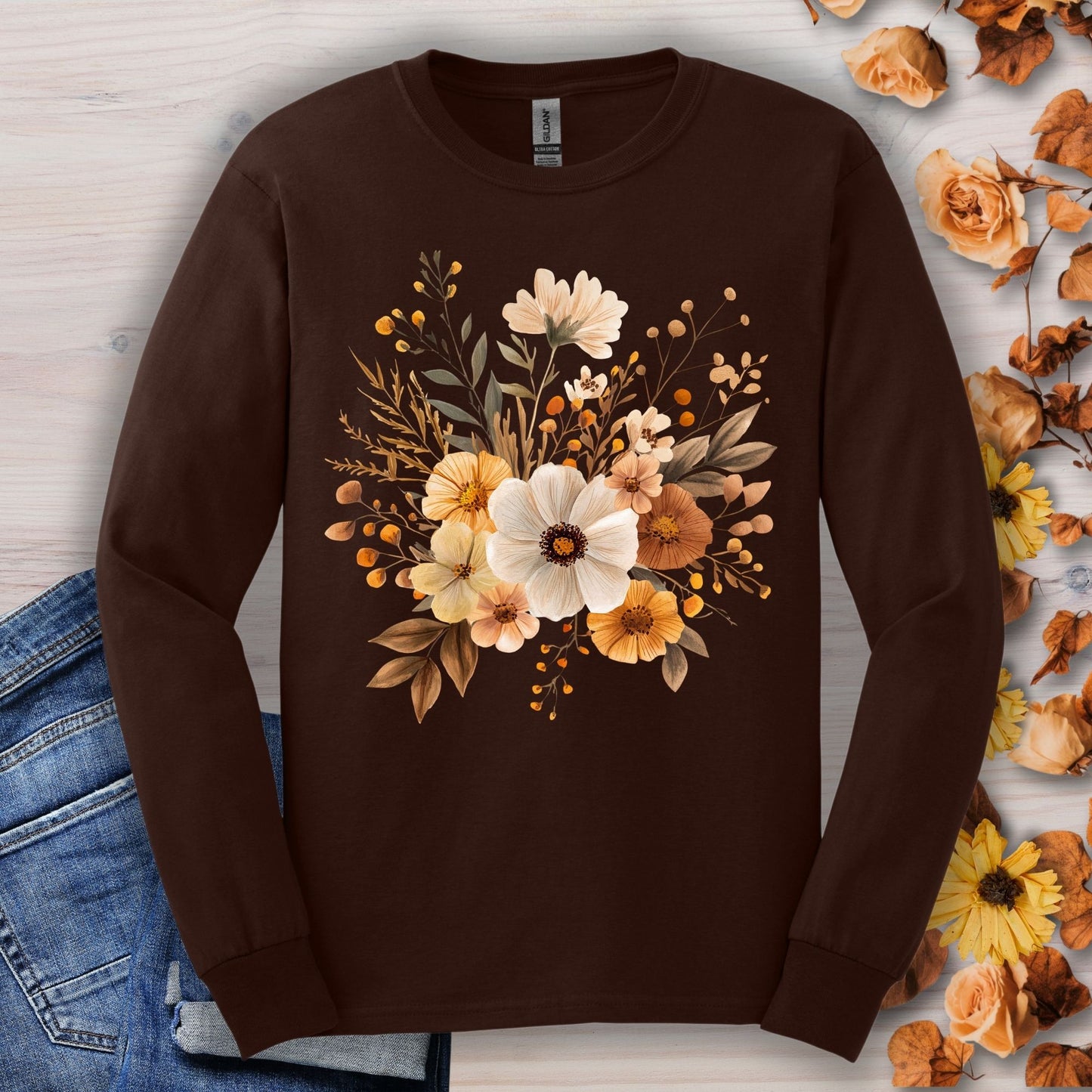 Dark Chocolate long sleeve Gildan tee with a muted autumn floral design, jeans, and fall foliage.