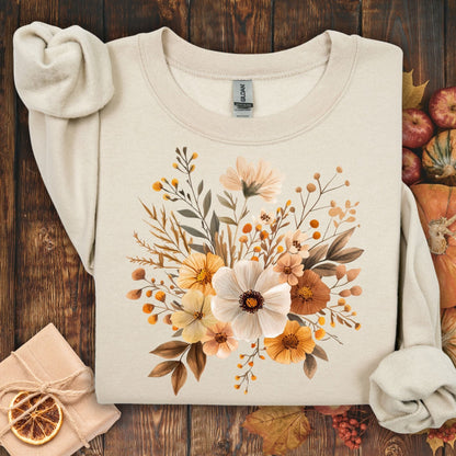 Sand Gildan 18000 sweatshirt with watercolor autumnal flowers in warm tones.