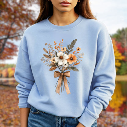 Light blue unisex sweatshirt with a watercolor autumn floral bouquet tied with a brown bow.