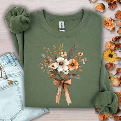 Military green sweatshirt with a watercolor harvest bouquet tied with a light brown bow.
