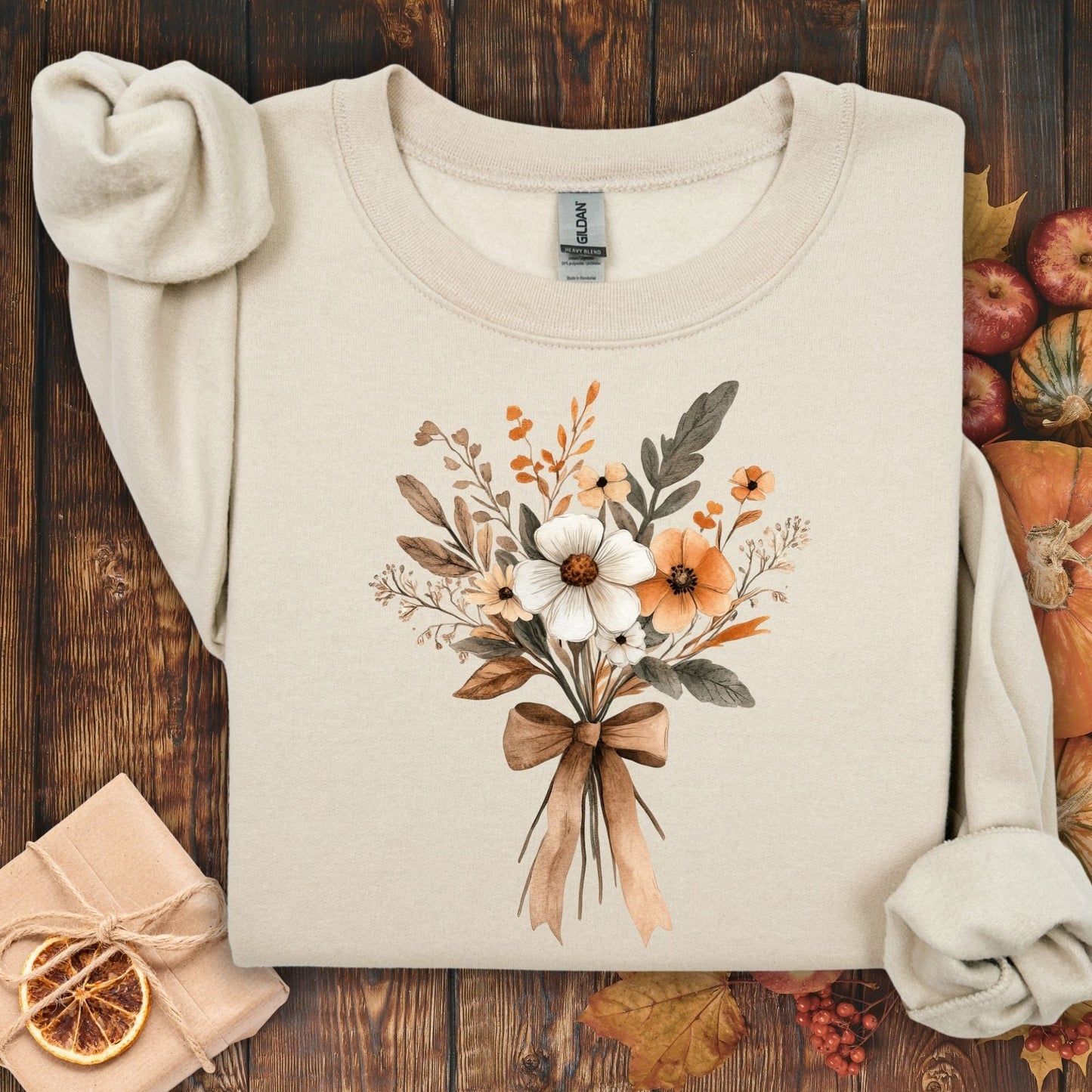 Sand unisex sweatshirt with a watercolor autumn floral bouquet and brown bow.