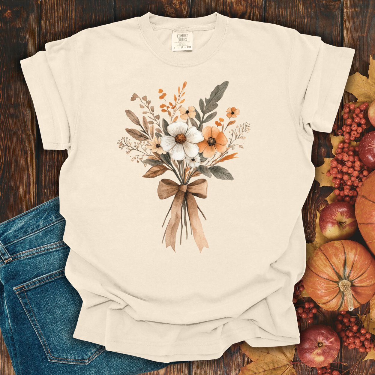 Ivory Harvest Bouquet T-Shirt with watercolor fall flowers and a brown ribbon, size S, made of cotton.